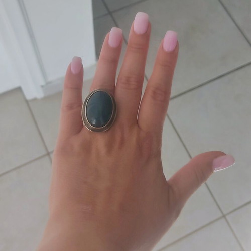 Silver large ring with petrol oval stone used