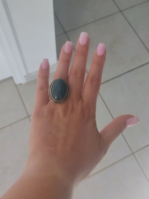 Silver large ring with petrol oval stone used