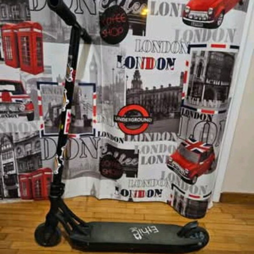 Scooter used for tricks with Ethic Vulcain 530 deck