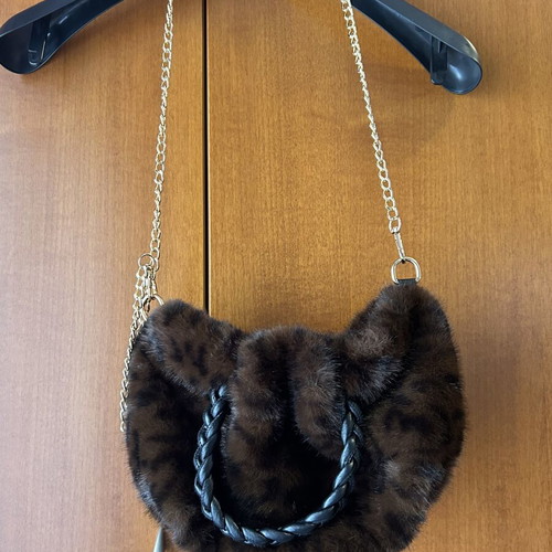 Small furry handbag with chain, black and brown