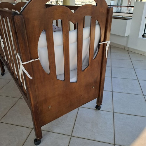 Wooden Baby Crib with Wheels and Protective Bumper, Walnut Color