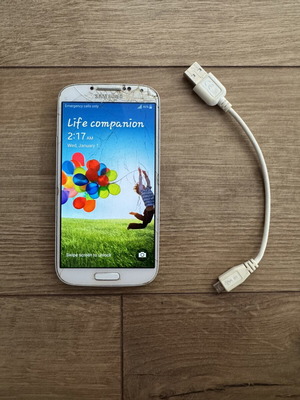 Samsung G1-9505 phone used with USB cord and 32 GB SD card, weak battery