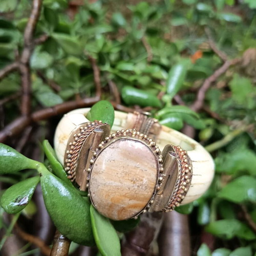 Boho bracelet used with bronze details beige