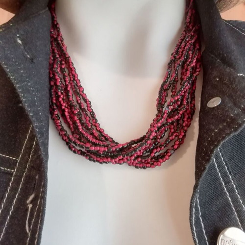 Boho style bronze necklace with small resin beads in burgundy and black