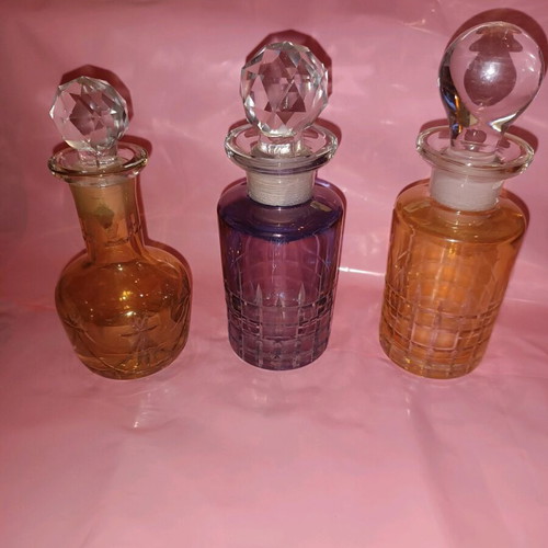 Set of 3 vintage perfume bottles with crystal stoppers like new