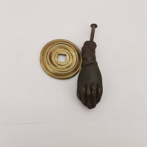 Bronze hand door knocker used from 1930 preserved door