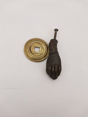 Bronze hand door knocker used from 1930 preserved door