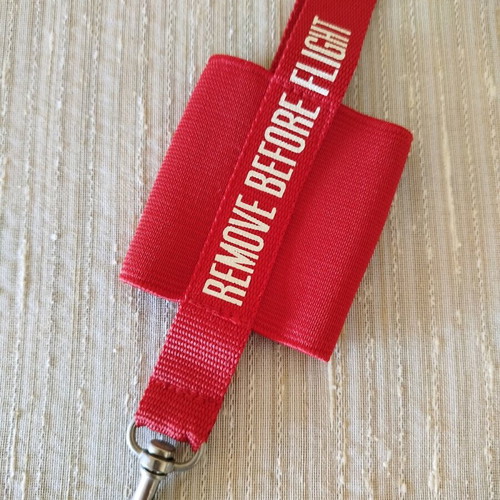 Lanyard used, red with elastic case for small phone