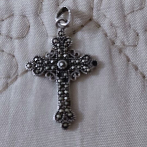 Silver cross like new, missing one small stone