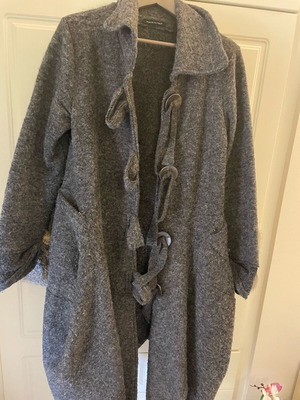 Long coat used with large buttons