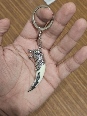 Keychain with wolf head tooth design like new, white