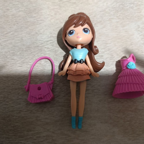 Littlest Pet Shop doll used with outfits and accessories