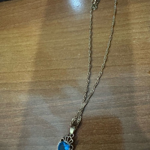 Necklace with blue heart used, not steel