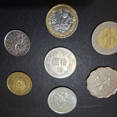 Collection of 7 Asian and European foreign coins