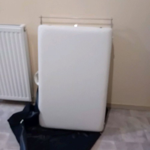 Massage bed like new, white with nickel base and folding feature