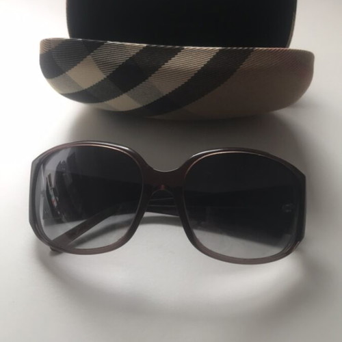 Burberry sunglasses and case used with minor defect