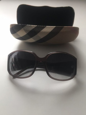 Burberry sunglasses and case used with minor defect