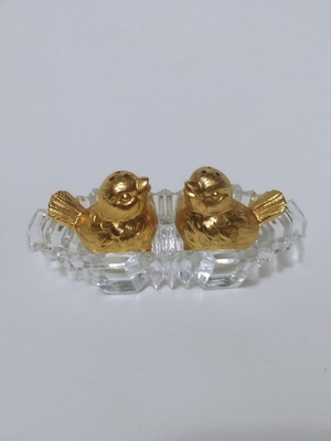 Set of gilded miniature salt and pepper shakers with lead tray