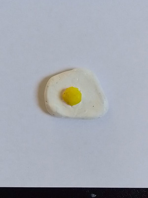 Handmade egg magnet from clay