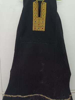 Traditional collectible wool folk art dress used with wear