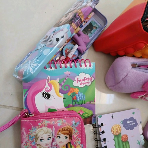 School supplies used, pencil cases, erasers, paints, notebooks, pencils