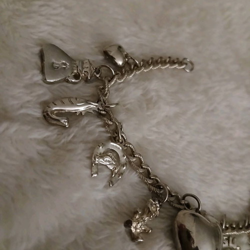 Silver bracelet with charms like new