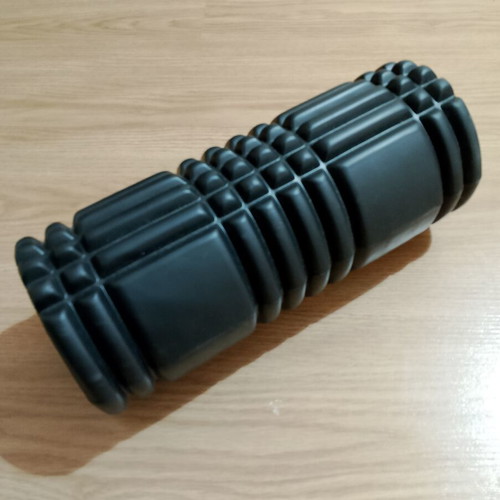 Foam roller like new with textured surface for massage and muscle recovery
