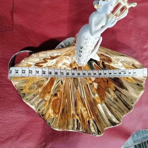 Mermaid and clam used, gold and porcelain decoration
