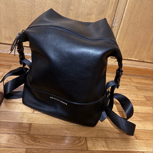 Leather backpack like new, black with orange lining