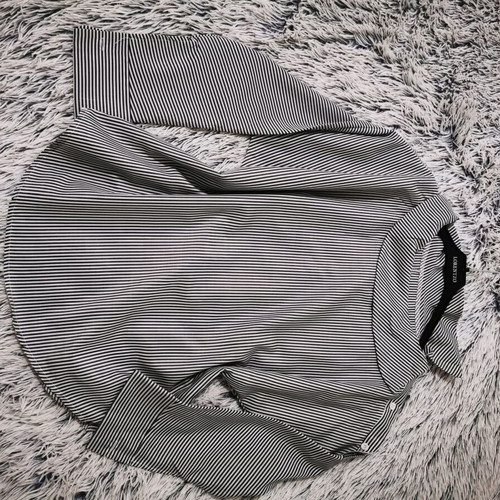Blouse with smile neckline like new, striped black and white
