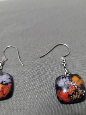 Handmade glass drop earrings with colorful abstract patterns, silver clasp