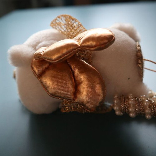 Christmas teddy bear like new with golden caramel and feathers