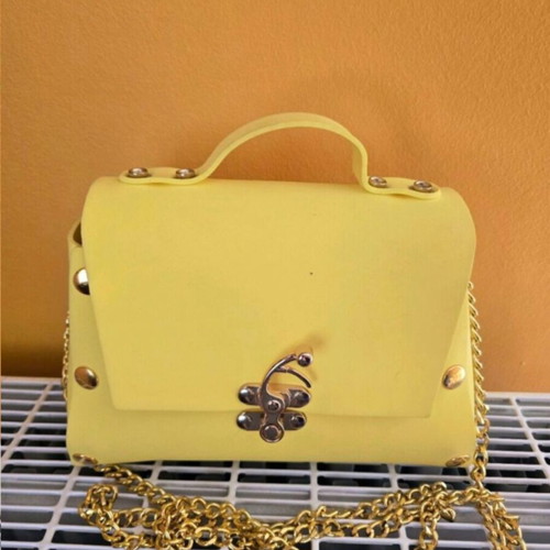 Women's yellow shoulder bag made of foam, used