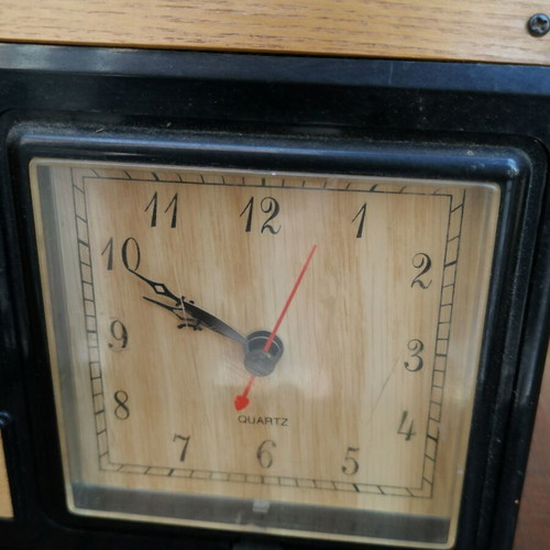Vintage decorative wall telephone with clock used