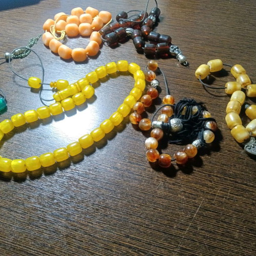 Worry beads like new, all together, in green, brown, yellow, orange