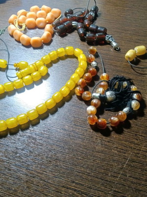 Worry beads like new, all together, in green, brown, yellow, orange