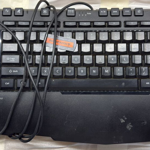 Microsoft SideWinder X6 keyboard used with detachable numeric keypad and red lighting