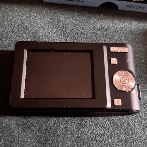 Digital camera used with velvet case, cable, battery, and strap