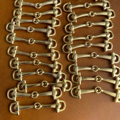 Metal decorative snaffle bits 22 pieces like new, gold color