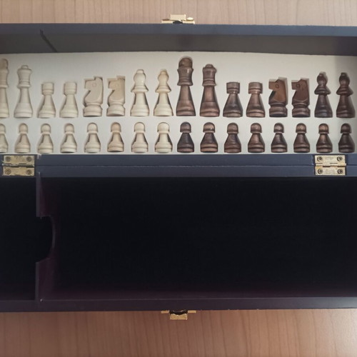 Wooden wine case used with travel chess set