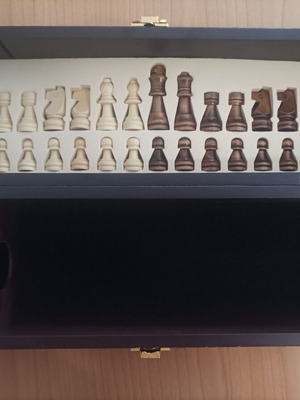 Wooden wine case used with travel chess set
