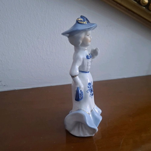 Retro porcelain woman figurine with gold details like new