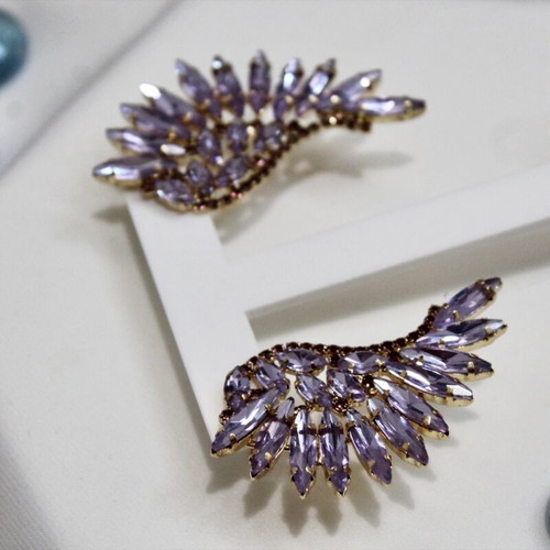 Earrings with purple stones angel wing design like new