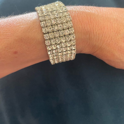 Bracelet with Crystals like new, silver color, elastic and sparkling