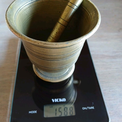 Antique brass mortar used with subtle design