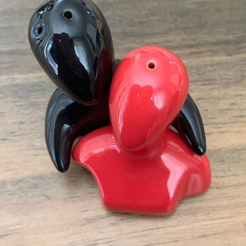 Salt and pepper shakers hugging pair like new