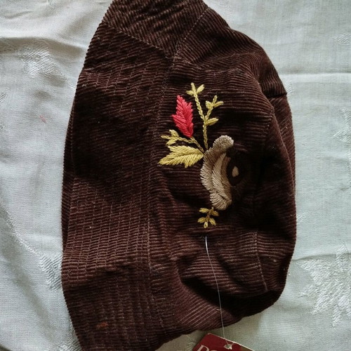 Women's hat new with brown embossed floral design