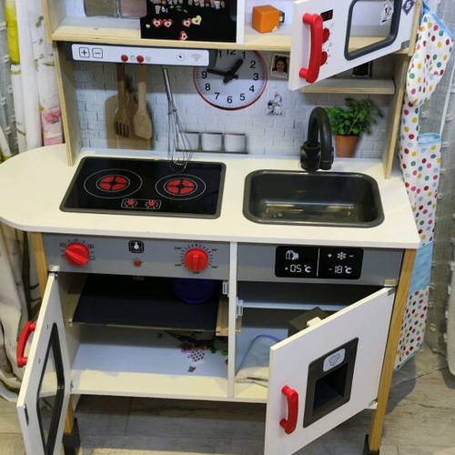 Children's wooden kitchen used with sounds and light