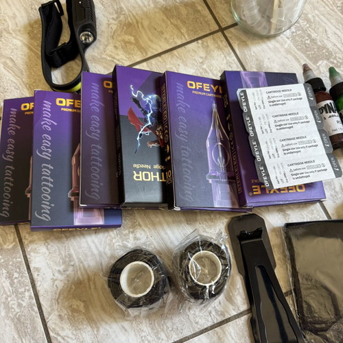 Tattoo supply kit with cartridges, inks, and accessories