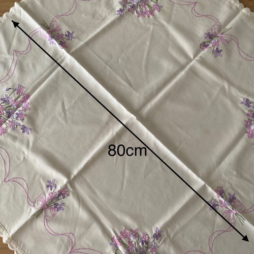 Rectangular table cloth used, white with pink and purple flowers 80x80cm
